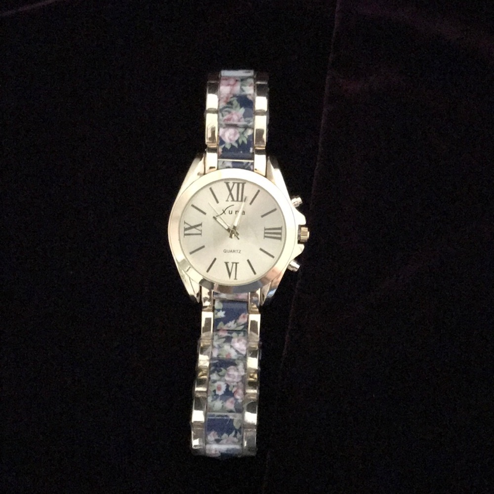 Gold watch with roses decorations on bracelet